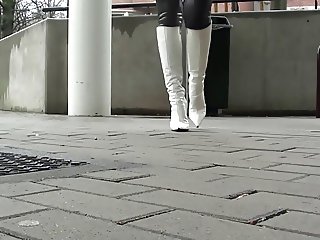 smoking and walking in leather outfit + high heels boots: