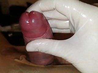 Slow handjob with latex gloves and urethral sounding